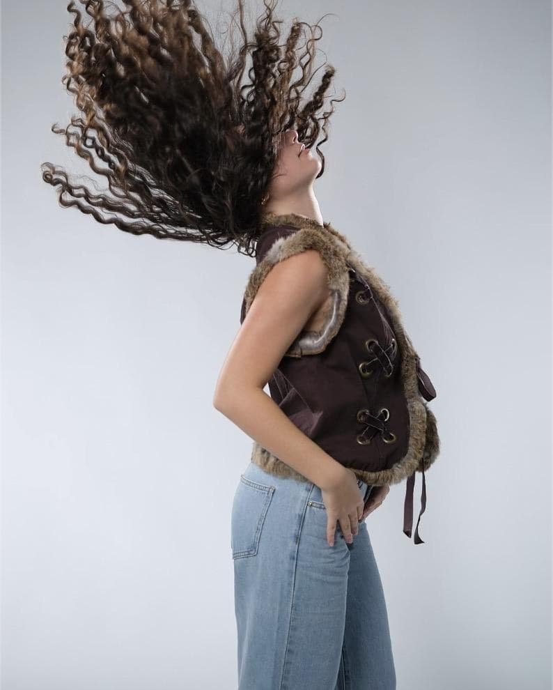 Catherine Bazizi, full-body studio portrait with hair flip